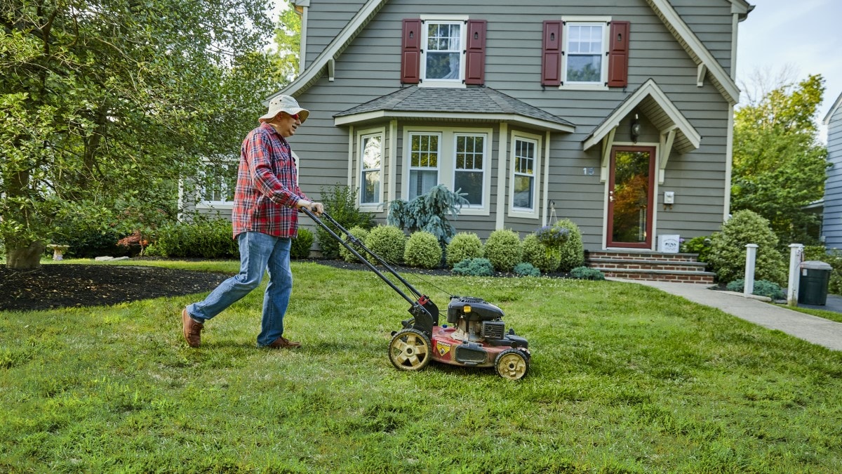 a man mowing his lawn