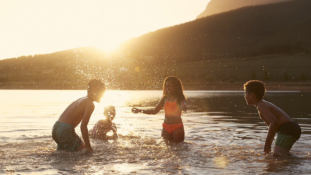 Swimmer's itch about Kids swimming and playing in lake.